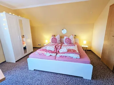 Ein Bett oder Betten in einem Zimmer der Unterkunft L5 - Urlaubsmagie - Mit Küche direkt am Wanderweg