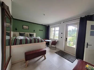 Ein Bett oder Betten in einem Zimmer der Unterkunft Hillehof Ostrau