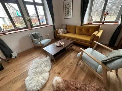 Ein Sitzbereich in der Unterkunft Ferienwohnung Hortensie Rittergut Schloss Zehista Gutshaus