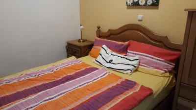 Ein Bett oder Betten in einem Zimmer der Unterkunft Ferienwohnungen Antonsruh im Kirnitzschtal