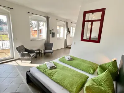 Ein Bett oder Betten in einem Zimmer der Unterkunft Meißner Elb-Domizil 2