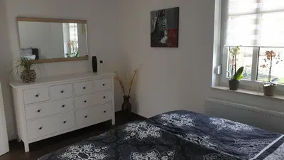 Ein Bett oder Betten in einem Zimmer der Unterkunft SeenSucht & Urlaubsträume, Ferienwohnung 