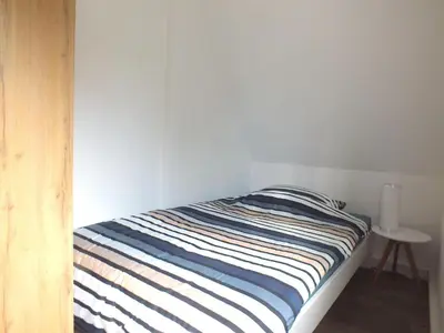 Ein Bett oder Betten in einem Zimmer der Unterkunft Family Escape in Lichtenau