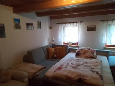 Ein Bett oder Betten in einem Zimmer der Unterkunft Ferienwohnung zum Sebnitzer Hirsch