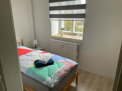 Ein Bett oder Betten in einem Zimmer der Unterkunft Monteur Ferienwohnungen OT Kleinwaltersdorf mit Außensitzecke und Grill
