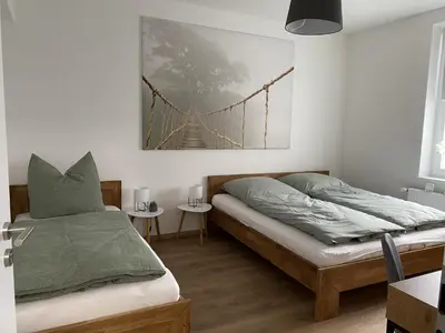 Ein Bett oder Betten in einem Zimmer der Unterkunft Apartment Pöppelmann