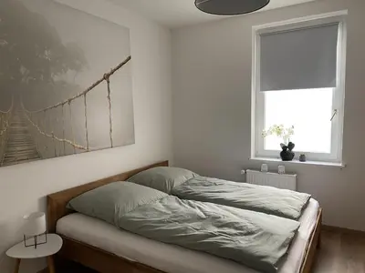 Ein Bett oder Betten in einem Zimmer der Unterkunft Apartment Pöppelmann