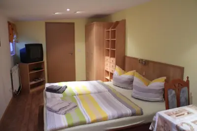Ein Bett oder Betten in einem Zimmer der Unterkunft Pension Scheers