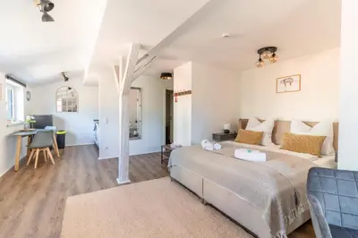 Ein Bett oder Betten in einem Zimmer der Unterkunft Daniels Apartment an der Schloßbrücke