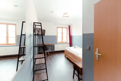 Ein Bett oder Betten in einem Zimmer der Unterkunft Restaurant und Pension Alberthafen