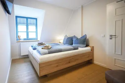 Ein Bett oder Betten in einem Zimmer der Unterkunft Pension 