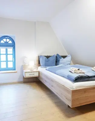 Ein Bett oder Betten in einem Zimmer der Unterkunft Pension 