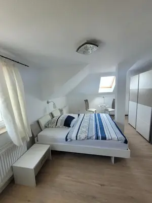 Ein Bett oder Betten in einem Zimmer der Unterkunft Pension Schützenhaus Leisnig