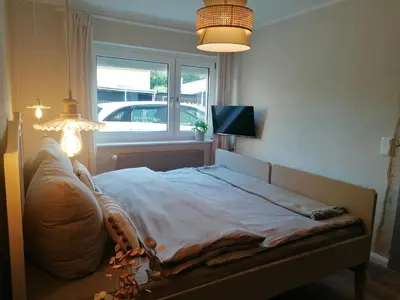 Ein Bett oder Betten in einem Zimmer der Unterkunft Haus Sandstein Glück Biedermann
