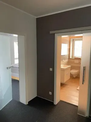 Ein Bett oder Betten in einem Zimmer der Unterkunft The Coffee Jacket Apartment