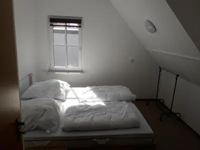 Ein Bett oder Betten in einem Zimmer der Unterkunft Ferinwohnung an der Promnitz Radeburg