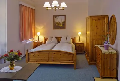 Ein Bett oder Betten in einem Zimmer der Unterkunft Parkvilla Bad Lausick