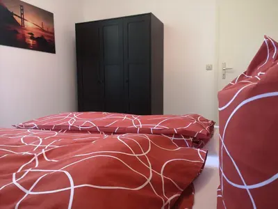 Ein Bett oder Betten in einem Zimmer der Unterkunft Bischofswerda Ferienwohnung Familienfreundlich Seniorengerecht