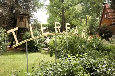 Ein Garten an der Unterkunft Bischofswerda Ferienwohnung Familienfreundlich Seniorengerecht