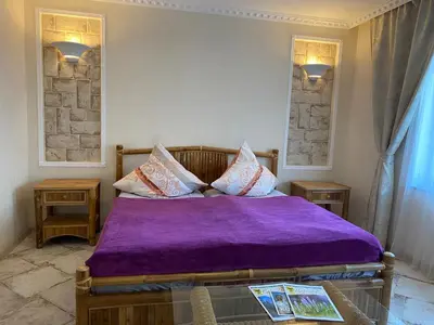 Ein Bett oder Betten in einem Zimmer der Unterkunft Griechischer Palast