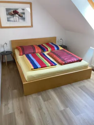 Ein Bett oder Betten in einem Zimmer der Unterkunft Ferienwohnung Teichblick -Balkon-